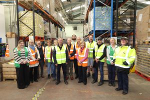 Ms Lucy Winskell OBE pictured alongside her Deputy Lieutenants and FareShare North East Staff and Volunteers in the Newcastle warehouse.